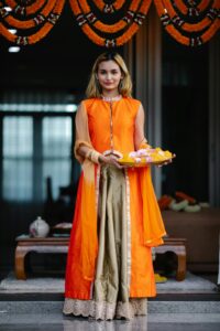 girl in yellow suit on haldi ceremony